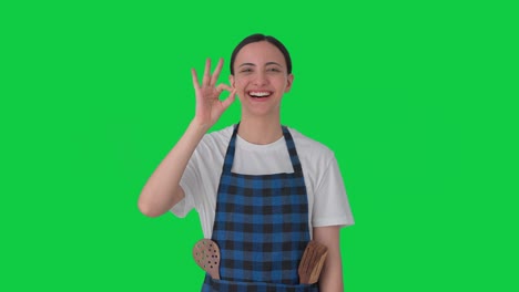 Happy-Indian-female-chef-giving-chef's-kiss-Green-screen