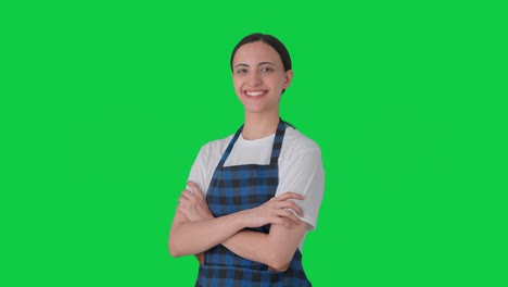 Portrait-of-Happy-Indian-housewife-standing-crossed-hands-Green-screen