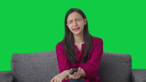 Tired-and-sleepy-Indian-woman-watching-TV-Green-screen