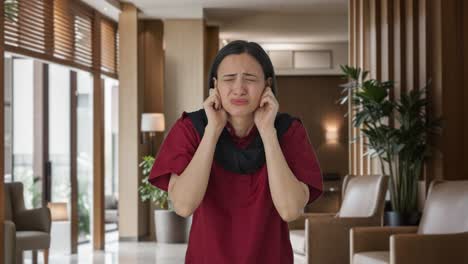 Sad-Indian-female-housekeeper-saying-sorry-and-apologizing