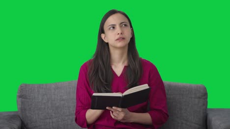Indian-woman-writing-a-diary-Green-screen