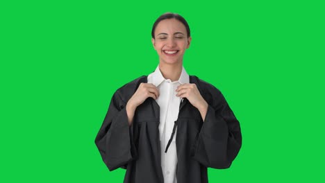 Happy-Indian-female-lawyer-wearing-gown-Green-screen