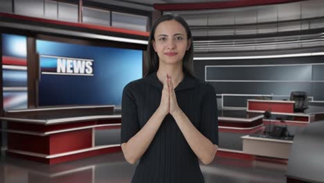 Happy-Indian-female-news-anchor-doing-Namaste