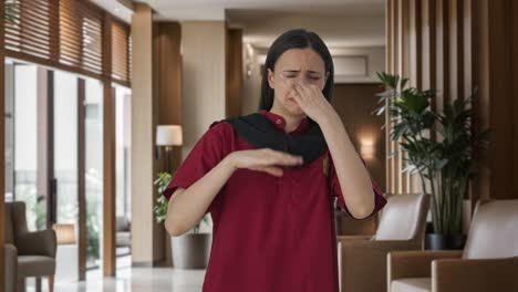 Upset-Indian-female-housekeeper-disgusted-by-bad-smell