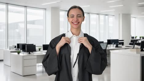 Happy-Indian-female-lawyer-wearing-gown