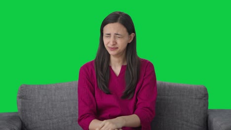 Tired-Indian-woman-yawning-and-relaxing-Green-screen