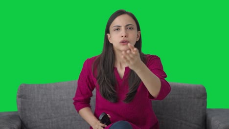 Indian-girl-sees-a-shocking-news-on-TV-Green-screen