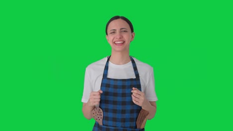 Happy-Indian-housewife-talking-to-someone-Green-screen