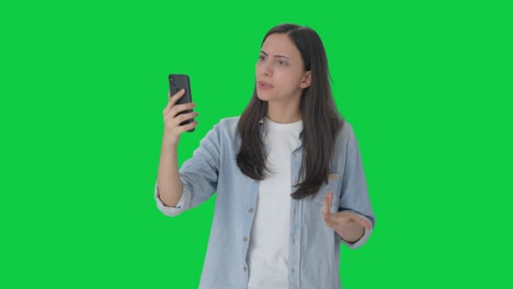 Angry-Indian-girl-talking-on-video-call-Green-screen