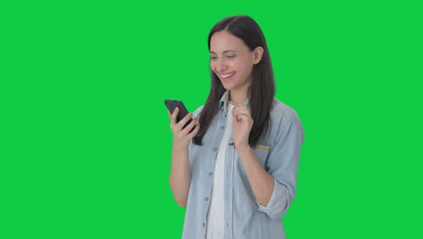 Happy-Indian-girl-using-phone-Green-screen