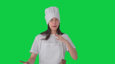 Indian-female-professional-chef-tasting-spicy-food-Green-screen