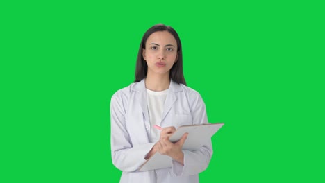 Indian-female-scientist-taking-notes-Green-screen