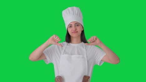 Upset-Indian-female-professional-chef-thumbs-down-Green-screen