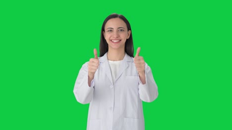 Happy-Indian-female-scientist-showing-thumbs-up-Green-screen