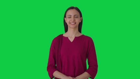 Happy-Indian-female-teacher-smiling-to-the-camera-Green-screen
