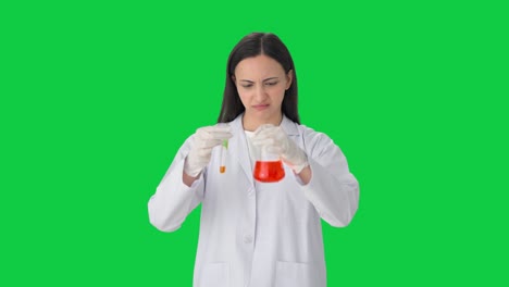 Confused-Indian-female-scientist-doing-experiments-in-a-lab-Green-screen