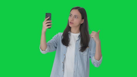 Indian-girl-talking-on-video-call-Green-screen