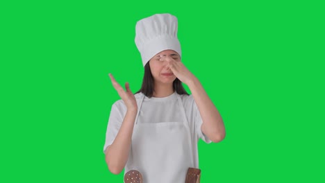 Upset-Indian-female-professional-chef-disturbed-by-bad-smell-Green-screen