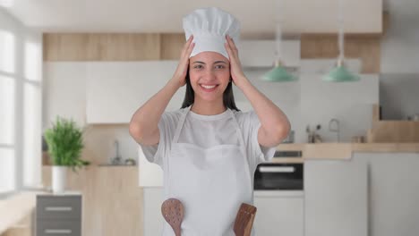 Happy-Indian-female-professional-chef-wearing-hat