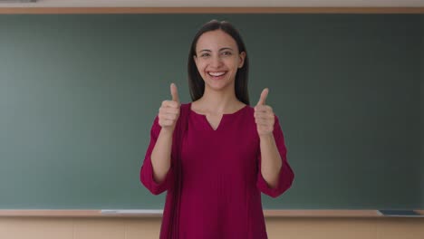 Happy-Indian-female-teacher-showing-thumbs-up