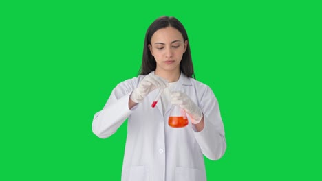 Indian-female-scientist-doing-experiments-in-a-lab-Green-screen