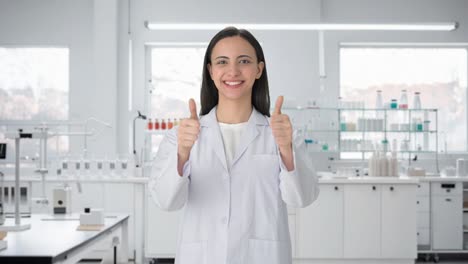 Happy-Indian-female-scientist-showing-thumbs-up