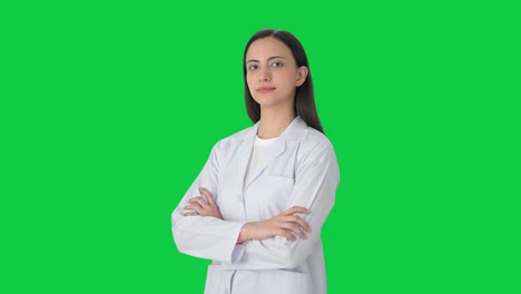 Portrait-of-Indian-female-scientist-standing-crossed-hands-Green-screen