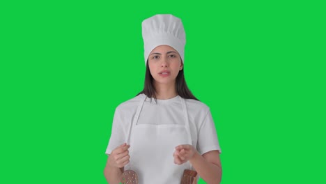 Indian-female-professional-chef-talking-to-the-camera-Green-screen