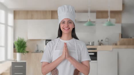 Happy-Indian-female-professional-chef-doing-Namaste