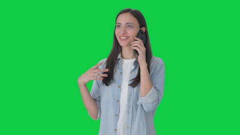 Happy-Indian-girl-talking-with-someone-on-call-Green-screen