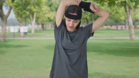 Happy-Indian-girl-doing-arm-exercise