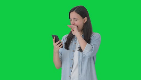 Tired-Indian-girl-using-phone-Green-screen