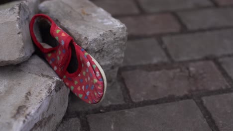 Kids-shoes-on-representing-civilian-casualties-in-an-active-war-zone