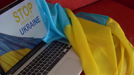 stop-war-and-patriot.-laptop,-flag-of-ukraine