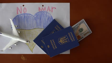 passports-and-money.-Ukrainian-symbols.-Refugees-and-IDPs-from-Ukraine-2022.