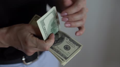 woman-hands-counting-money,-US-dollars
