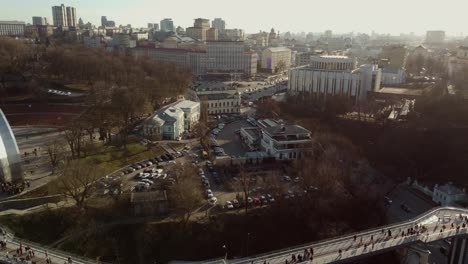 Scenic-top-panoramic-view-of-Kyiv-city-Podol-old-center,-Dnepr-river-Rybalskiy-island-panoramic-landscape.-Ukrainian-capital-Kiev-blizzard-panorama