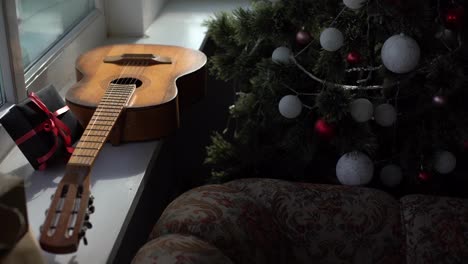 Flat-lay-composition-with-guitar-and-Santa-hat,-space-for-text.-Christmas-music