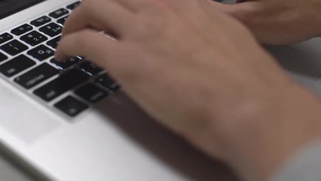 Hand-typing-on-laptop-keyboard,-personal-computer-use-for-work-at-office-or-home