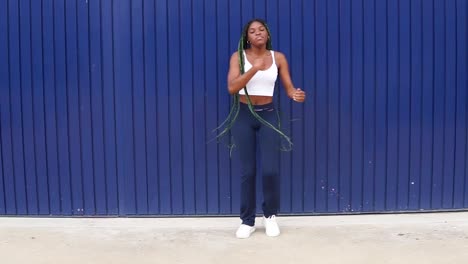 Young-dynamic-black-woman-dancing-on-street