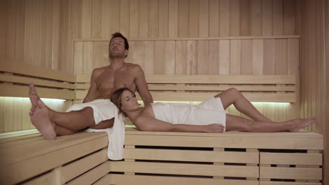 Couple-resting-in-hot-sauna