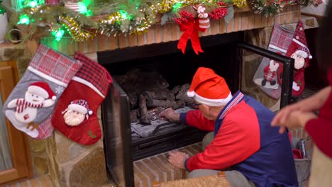 Man-lighting-fireplace-on-Christmas-day