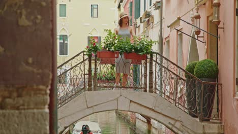Female-tourist-walking-on-brick-bridge