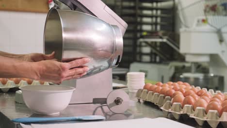 Confectioner-preparing-dough-in-mixer
