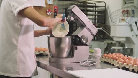 Confectioner-preparing-dough-in-mixer
