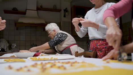 Crop-senior-woman-cooking-tortellini-at-home