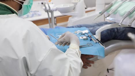 Dentist-using-tools-during-treatment-in-clinic