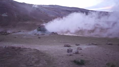 Hot-spring-with-steam-in-mountains