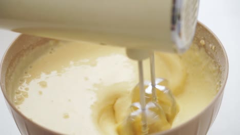 Close-up-of-a-mixer-whipping-a-batter