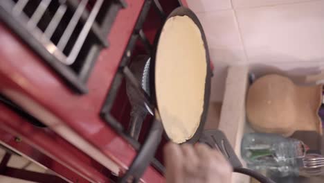 Woman-preparing-pancakes-on-pan